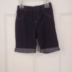 Girl's denim look shorts. Made of cotton, polyester and spandex. Size 6.